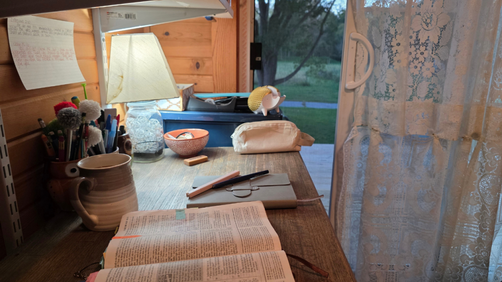 Open Bible and journal on a quiet desk